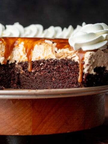 Caramel chocolate mousse cake on a cake plate.