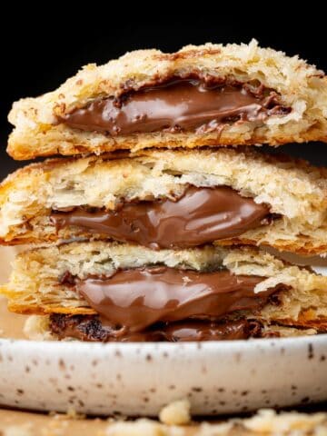A stack of Nutella hand pies on a small plate.