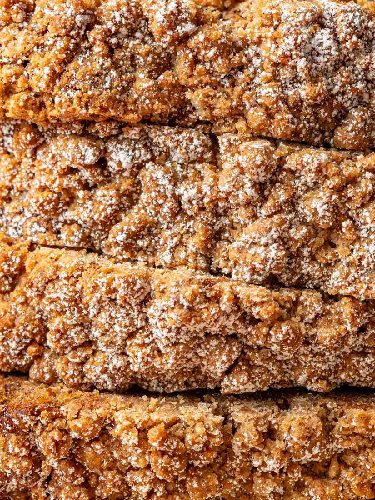 A close up of the banana bread topping with powdered sugar.