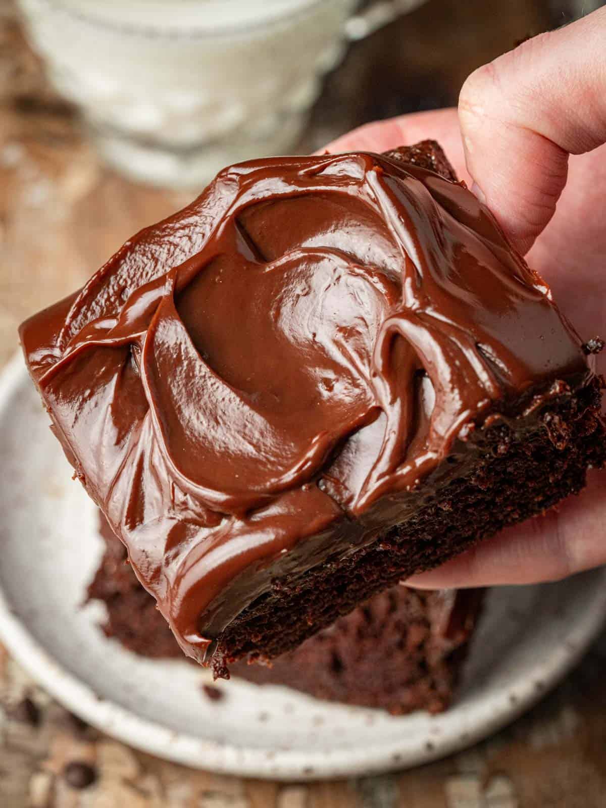 A close up of chocolate ganache on top of the chocolate cake.