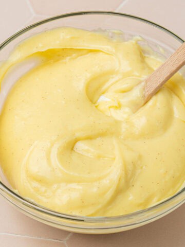 Showing the pastry cream in a glass bowl on the counter.